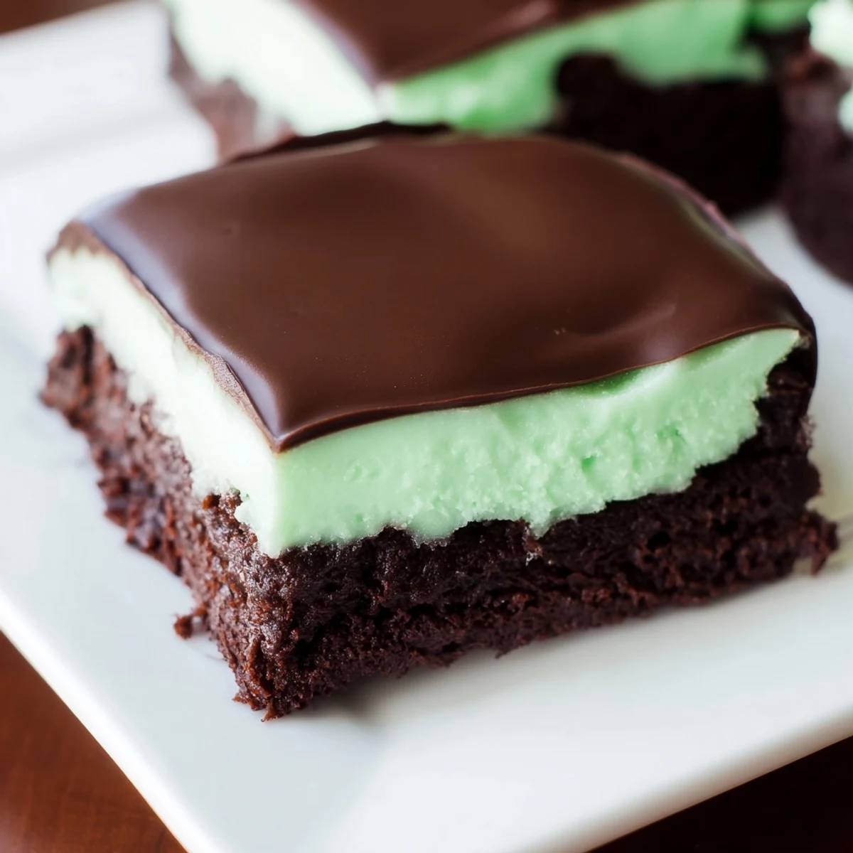 Deep-fudgy Shamrock Mint Brownies with Chocolate Ganache finished with a green mint swirl.