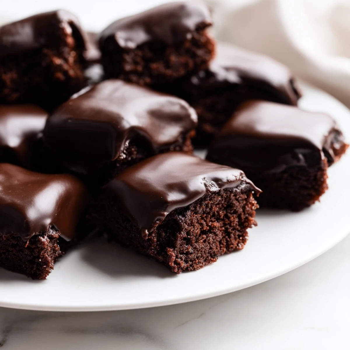 Bite-sized Mint Brownie Bites with Ganache, featuring a moist chocolate interior and a silky, cool peppermint topping.