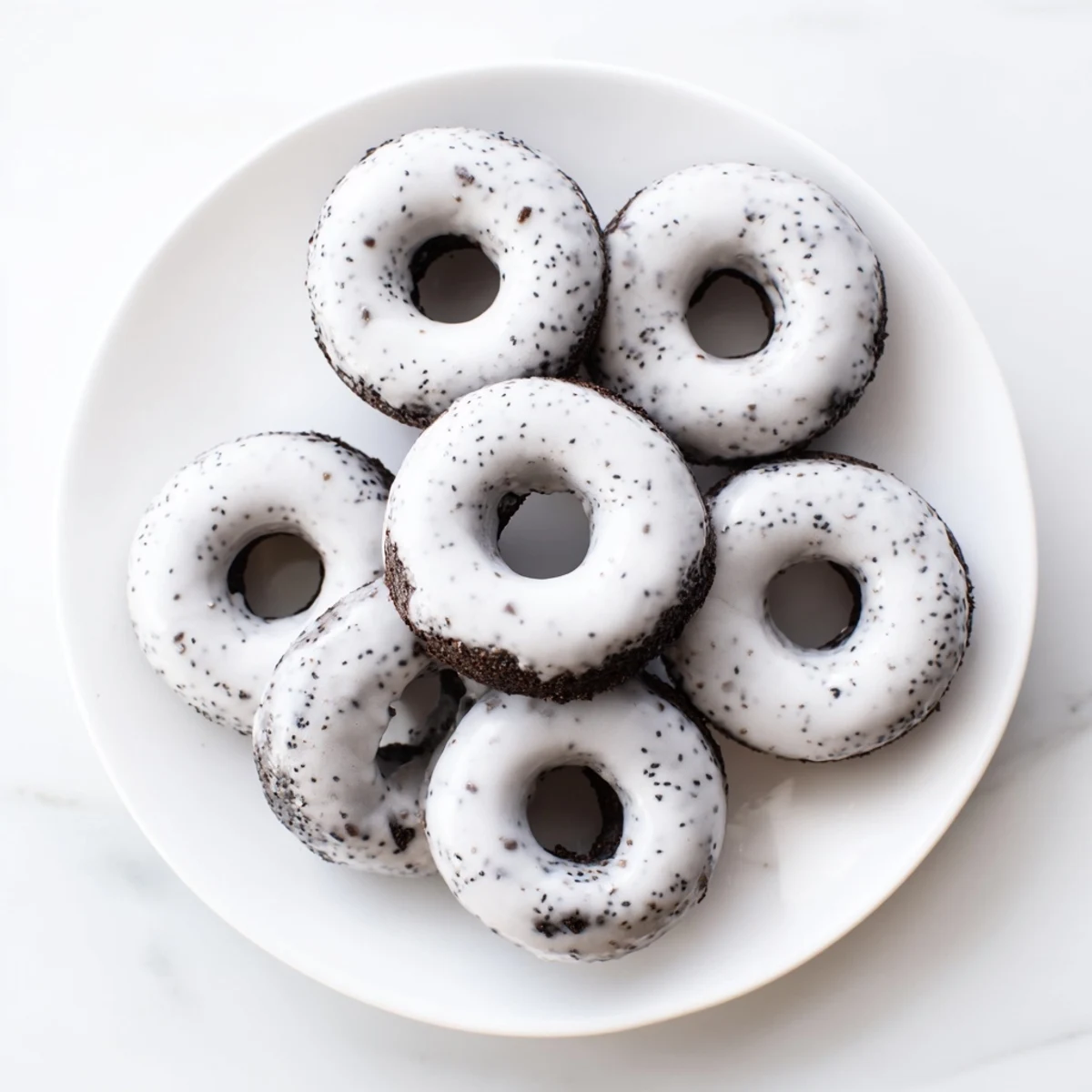 A close-up shows the crisp exterior and chewy mochi texture of Black Sesame Mochi Donuts, ready to be enjoyed.