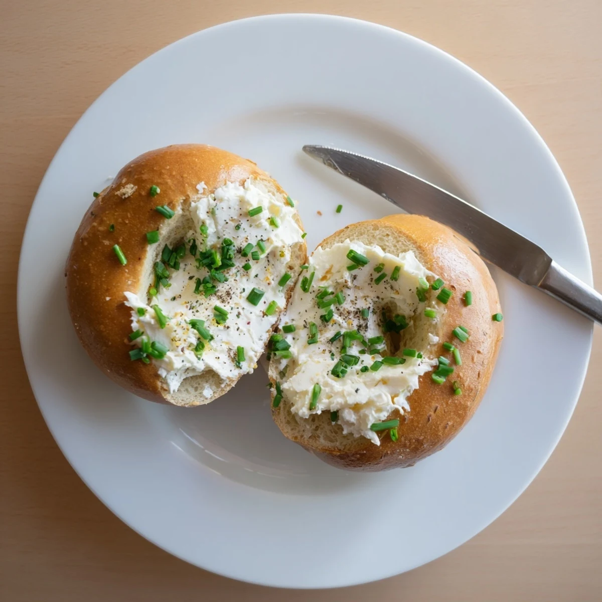 Warmly baked Protein Bagels with Cottage Cheese topped with creamy cottage cheese and fresh chives.