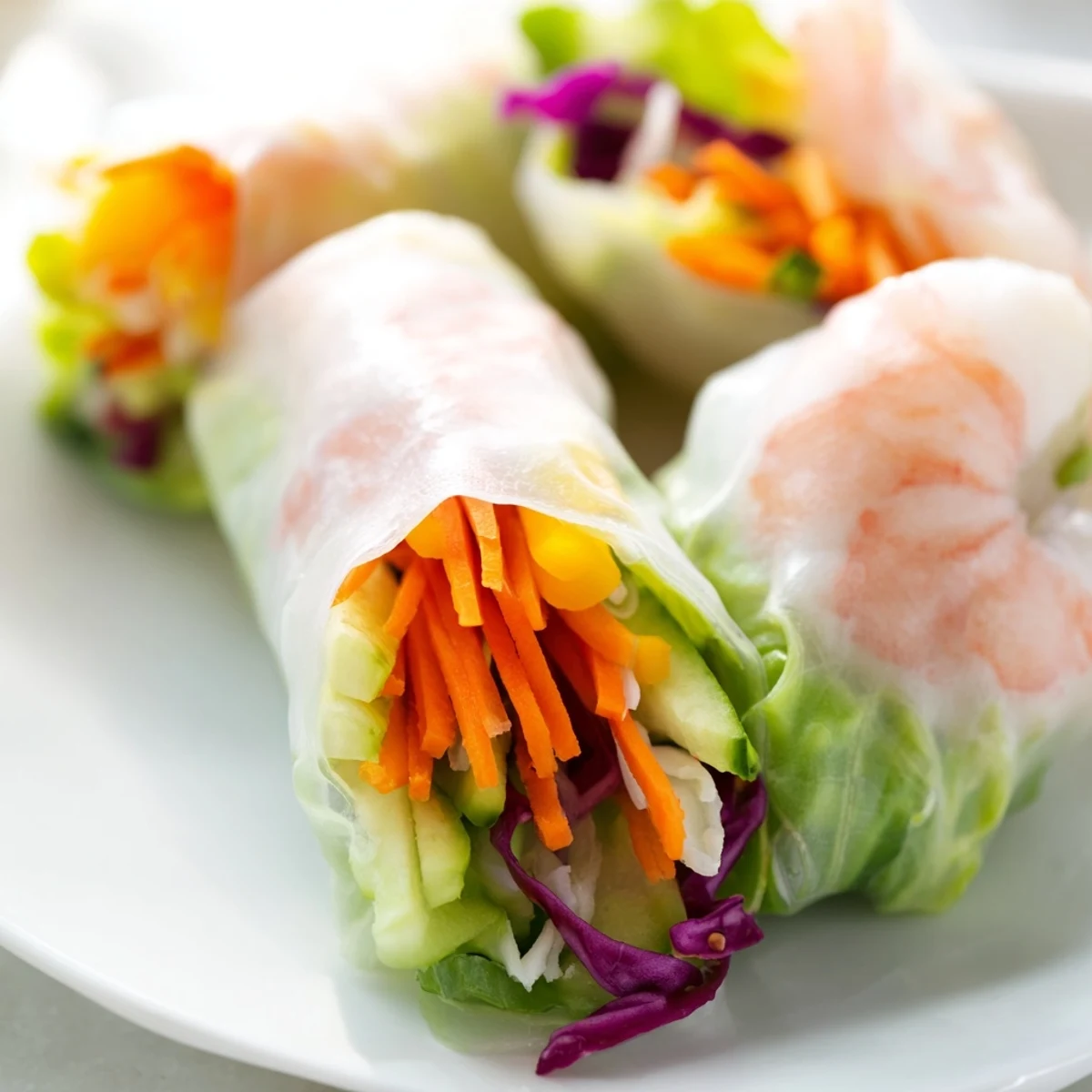 Fresh Thai shrimp rolls with peanut sauce feature crisp vegetables and herbs in translucent rice paper