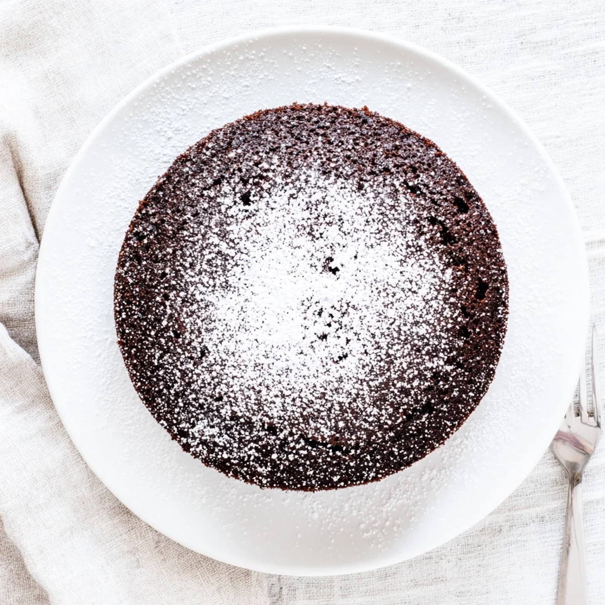 Decadent stout-infused chocolate cake baked in air fryer with whipped cream topping