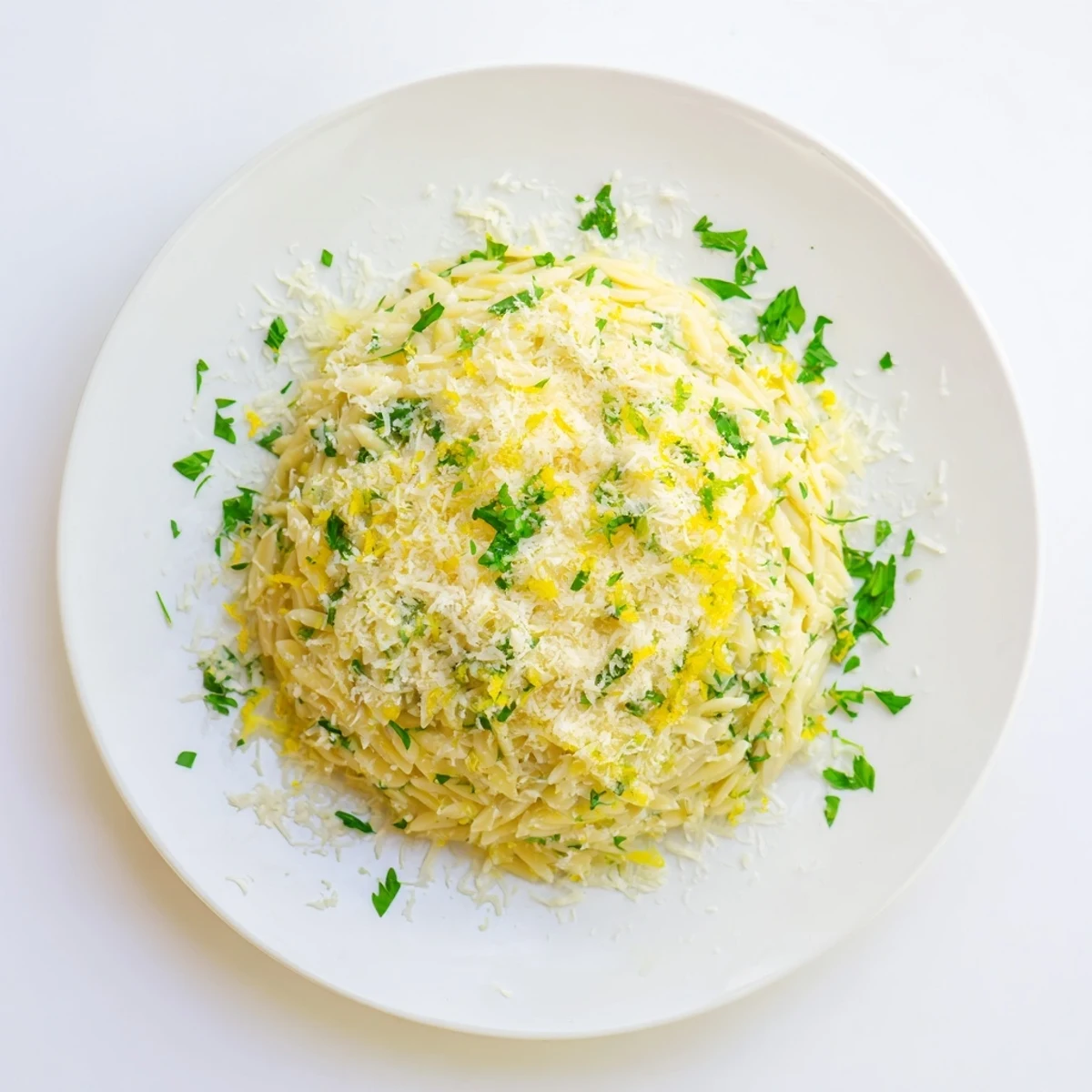 Tender orzo tossed with zesty lemon juice, butter, and olive oil for a bright Mediterranean side