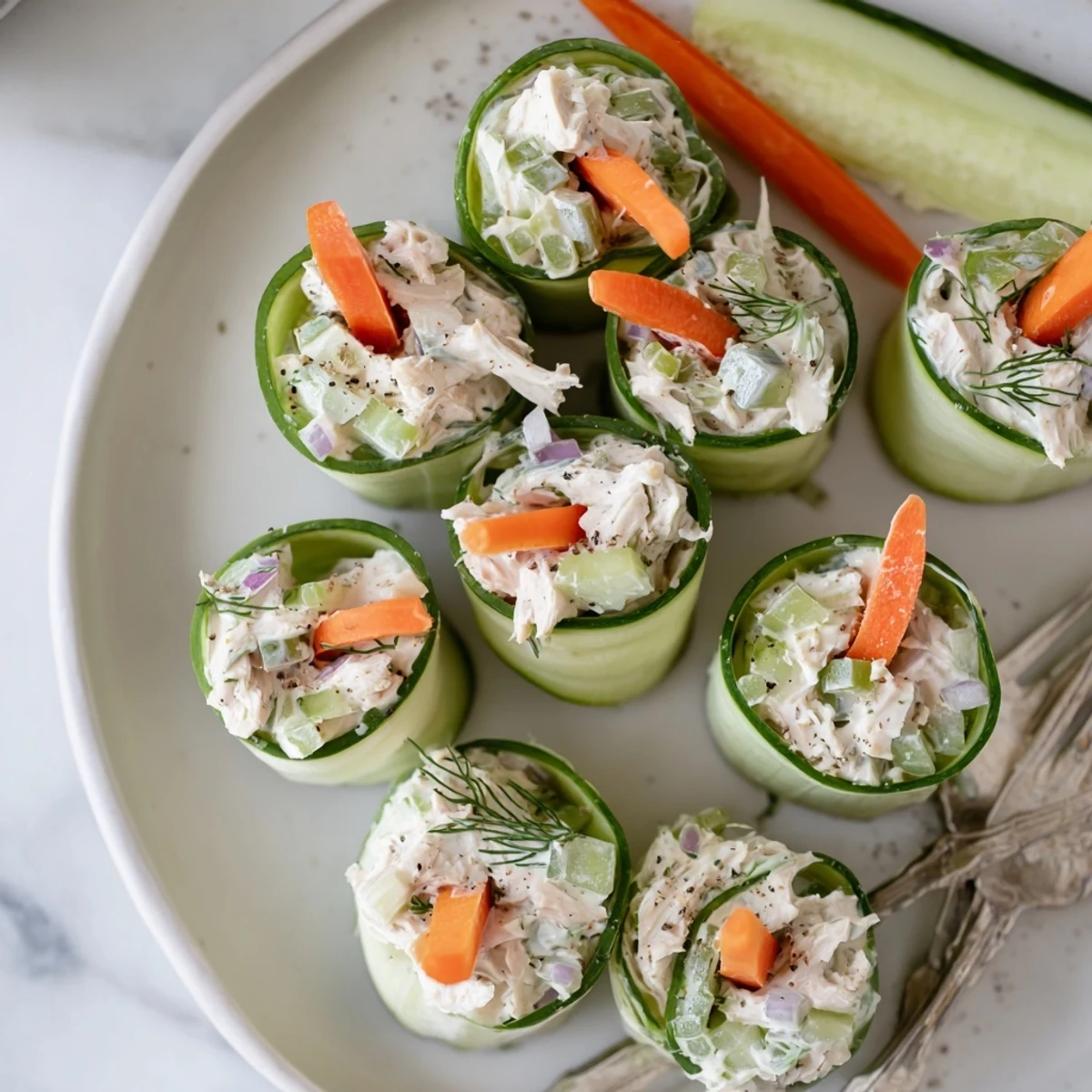 Creamy chicken salad tucked inside cool cucumber ribbons makes an elegant gluten-free party appetizer