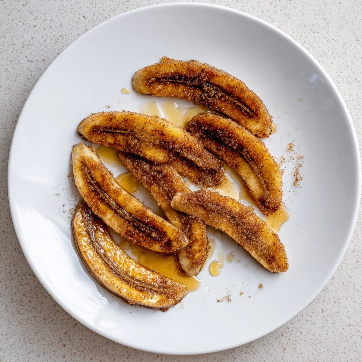 Warm pan fried cinnamon bananas sprinkled with brown sugar and served fresh