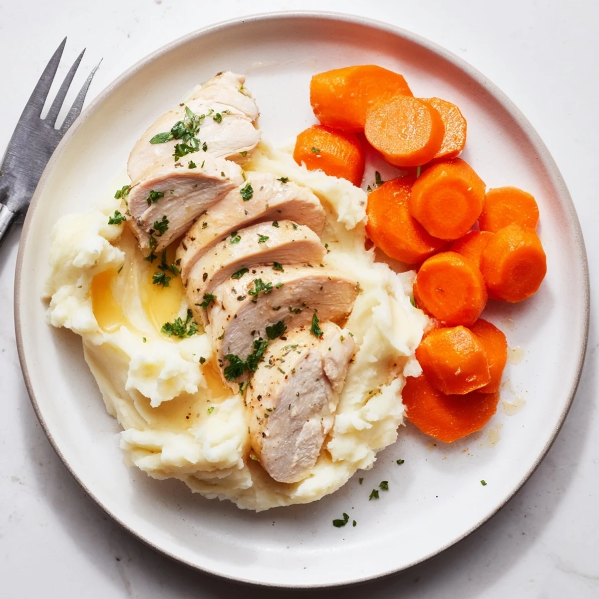 Juicy chicken seasoned with Italian herbs served over velvety buttery potatoes and sweet glazed carrot rounds for a comforting family dinner