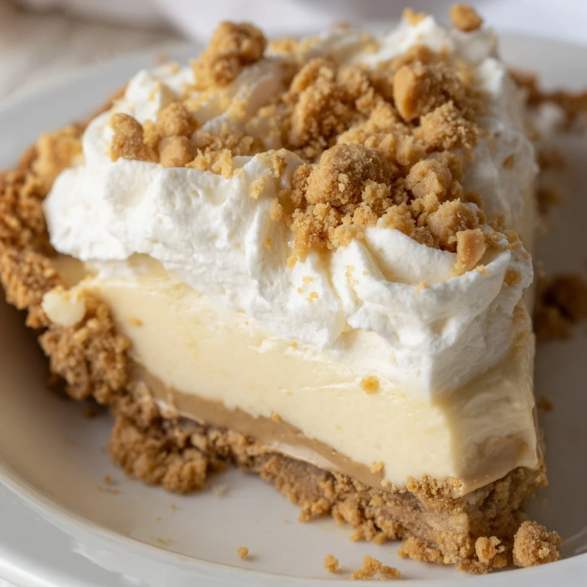 Velvety Old Fashioned Amish Peanut Butter Dream Pie sliced showing rich custard filling and flaky crust