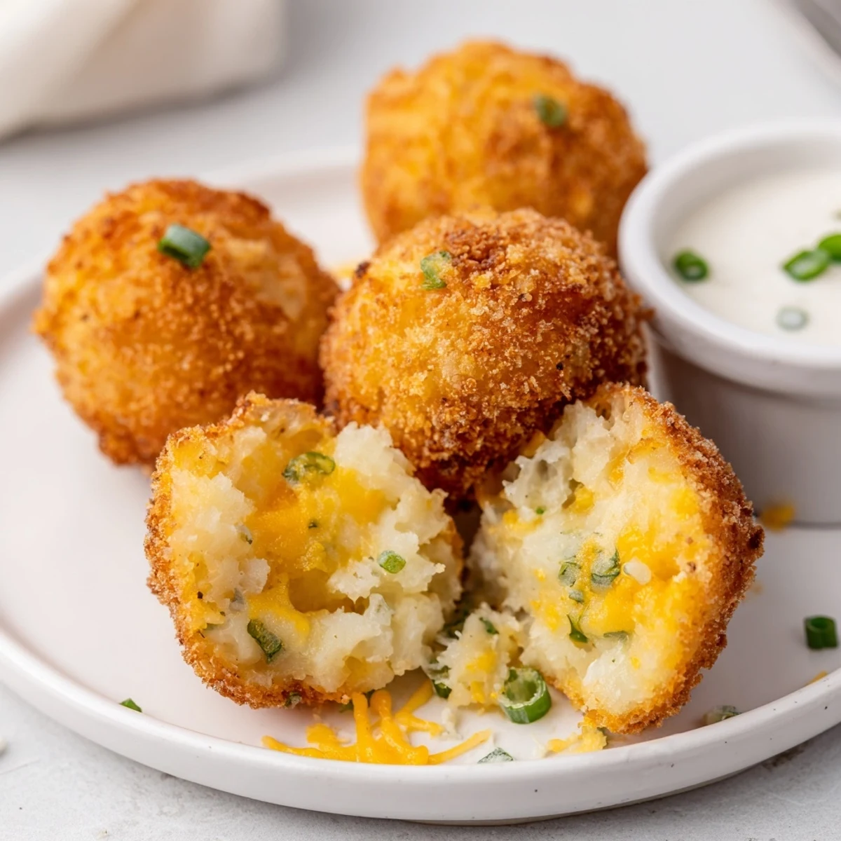 Hand-rolled Fried Mashed Potato Balls, panko-crusted and freshly fried on paper towels