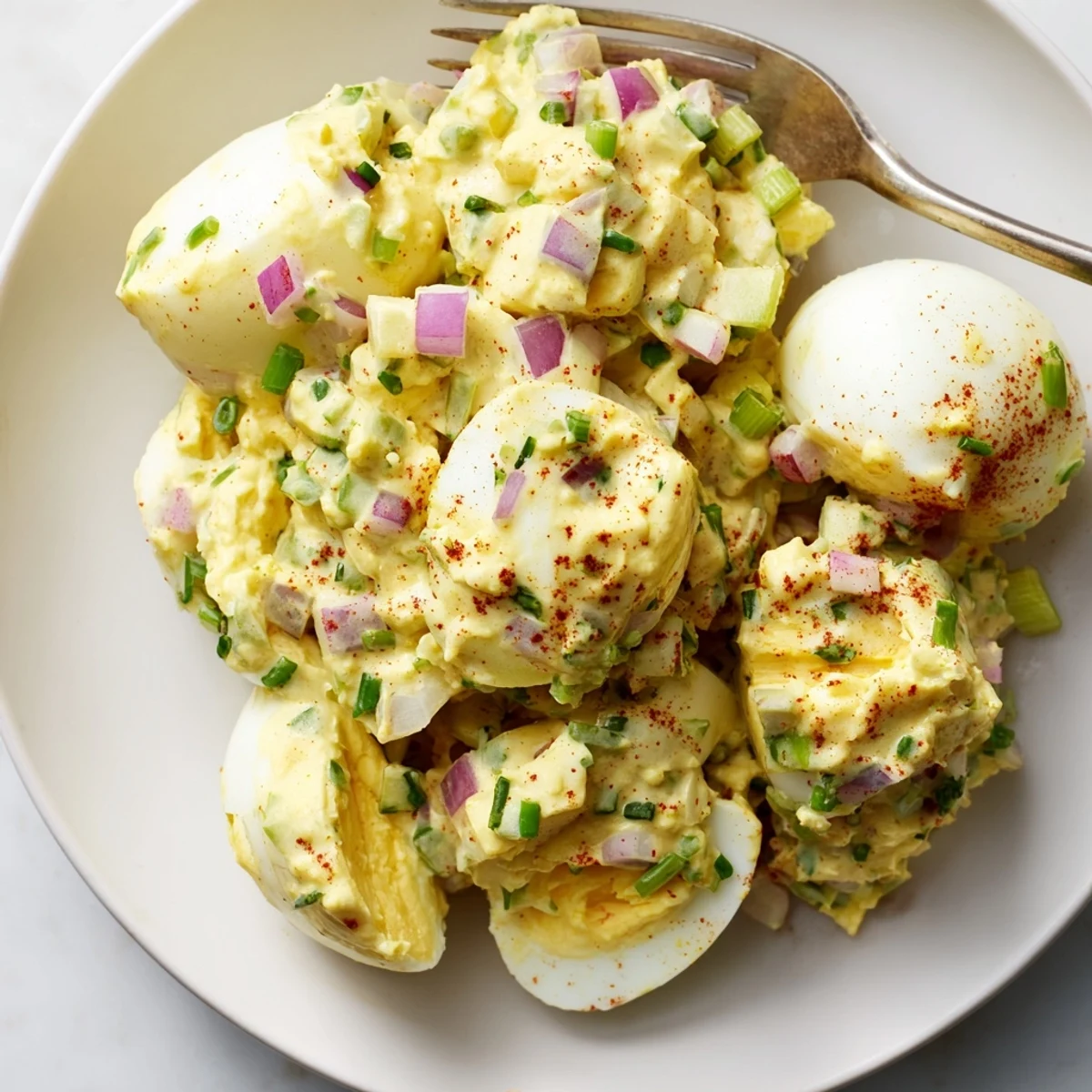 Classic Egg Salad Recipe on toasted sourdough, creamy texture with paprika sprinkle