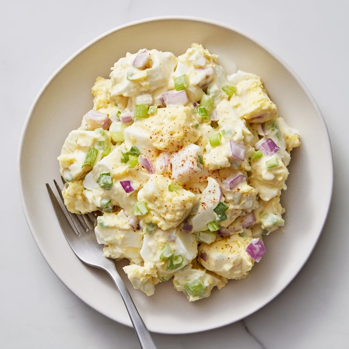 Simple Classic Egg Salad Recipe scooped into lettuce cups, crunchy celery bites